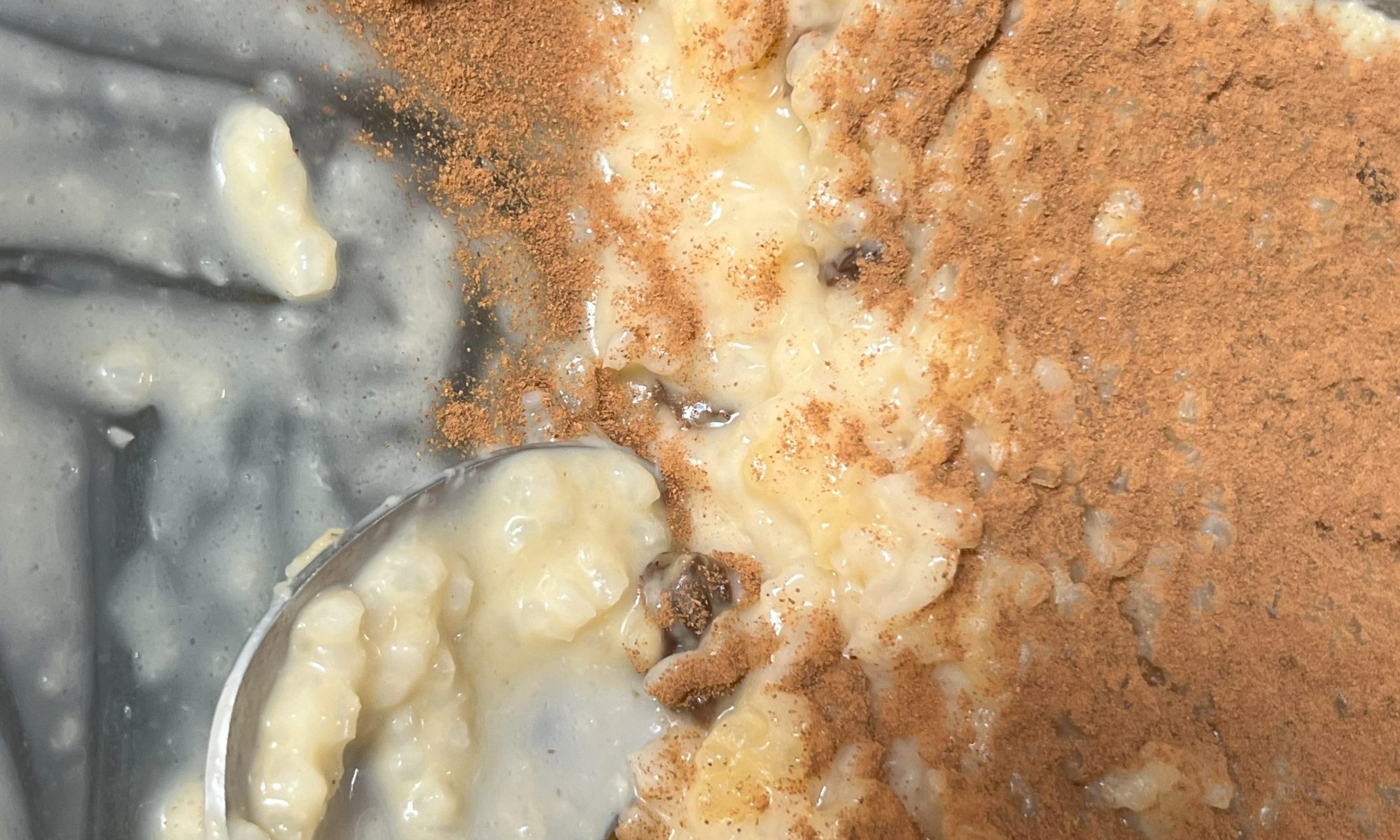 portuguese sweet rice being eaten in a dish